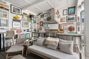 Sitting room with beam ceiling