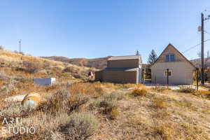 Exterior space with a mountain view and an outbuilding