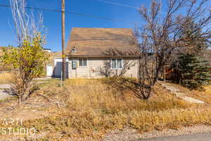 View of side of home featuring a garage