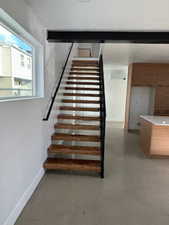 Stairway with concrete flooring