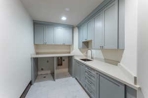 Interior space featuring sink and cabinets