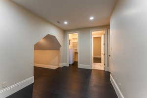 Additional living space with dark wood-type flooring