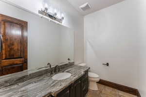 Bathroom with vanity and toilet