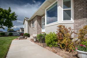 View of property exterior featuring a yard