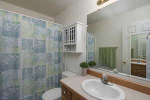 Bathroom featuring vanity and toilet