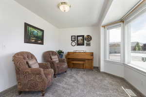 Sitting room with light carpet