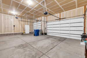 Garage featuring a garage door opener