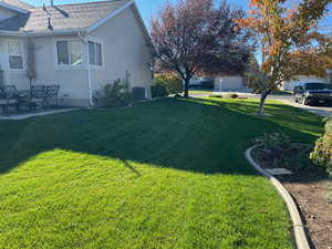 View of yard featuring cooling unit