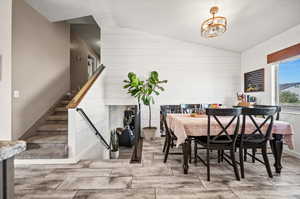 Dining space featuring vaulted ceiling