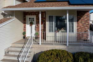 Entrance to property with covered porch