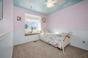 Bedroom with carpet floors and ceiling fan