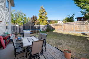 View of patio / terrace featuring a trampoline and a grill