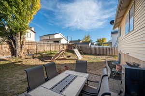 View of patio with a playground