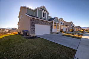 Front of property with a front yard and a garage