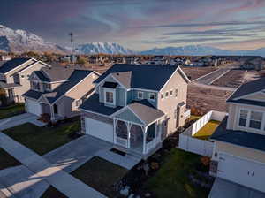 Aerial view at dusk featuring a mountain view