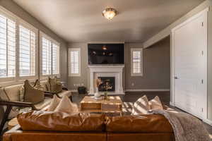 Living room featuring dark hardwood / wood-style floors and a textured ceiling