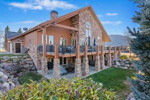 Rear view of property with a patio area and cooling unit