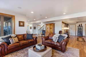 Living room with light hardwood / wood-style floors