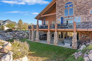 View of yard featuring a patio area and a deck