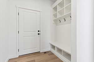Mudroom featuring built in cubbies