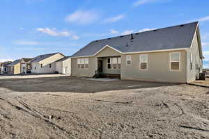 Rear view of property featuring cooling unit