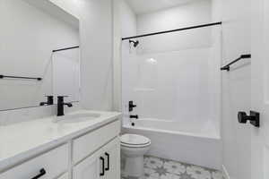 Full bathroom with vanity, toilet, and bathtub / shower combination