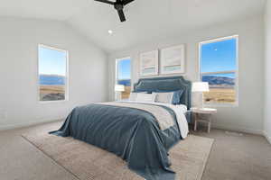 Bedroom with lofted ceiling, carpet flooring, and ceiling fan
