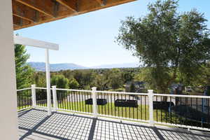 Exterior space with a mountain view and a lawn