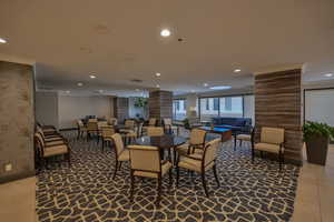 Community party room with kitchen and seating areas.