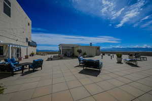 Rooftop patio area with seating.