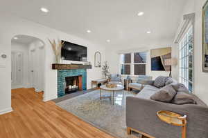 Living room featuring light hardwood / wood-style floors and a fireplace