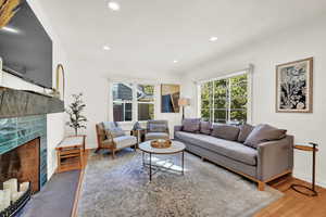 Living room with hardwood / wood-style flooring and a fireplace