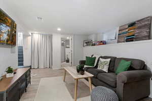 Living room featuring light hardwood / wood-style flooring