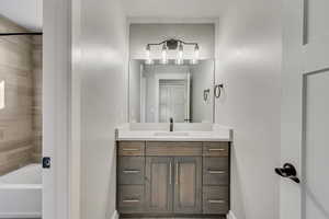 Bathroom with vanity and  shower combination