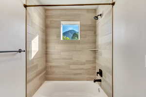 Full bath 2: Bathroom featuring tiled shower / bath combo