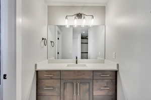 Tastefully finished master bathroom with vanity