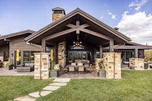 View of patio with an outdoor hangout area