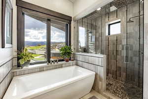 Bathroom featuring a mountain view and plus walk in shower