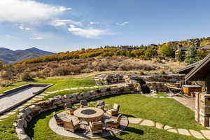 View of yard featuring a mountain view and a patio area