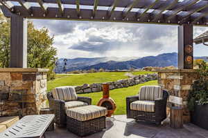 View of patio featuring a mountain view and a pergola