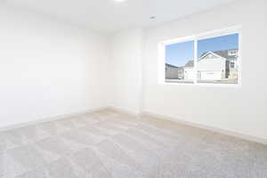 View of carpeted spare room