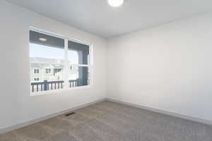 Unfurnished room with carpet floors