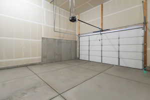 Garage featuring a garage door opener