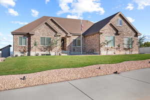 View of front of home featuring a front lawn