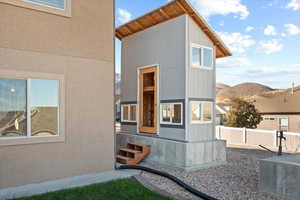 View of side of property with a mountain view