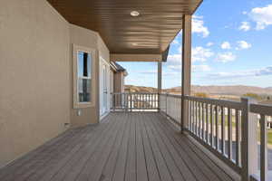 Wooden terrace featuring a mountain view