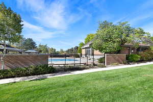 View of pool with a gazebo and a yard