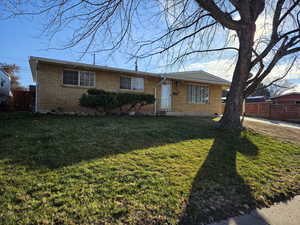 Single story home featuring a front yard