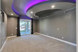 Carpeted empty room featuring a textured ceiling