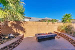 View of patio featuring an outdoor fire pit